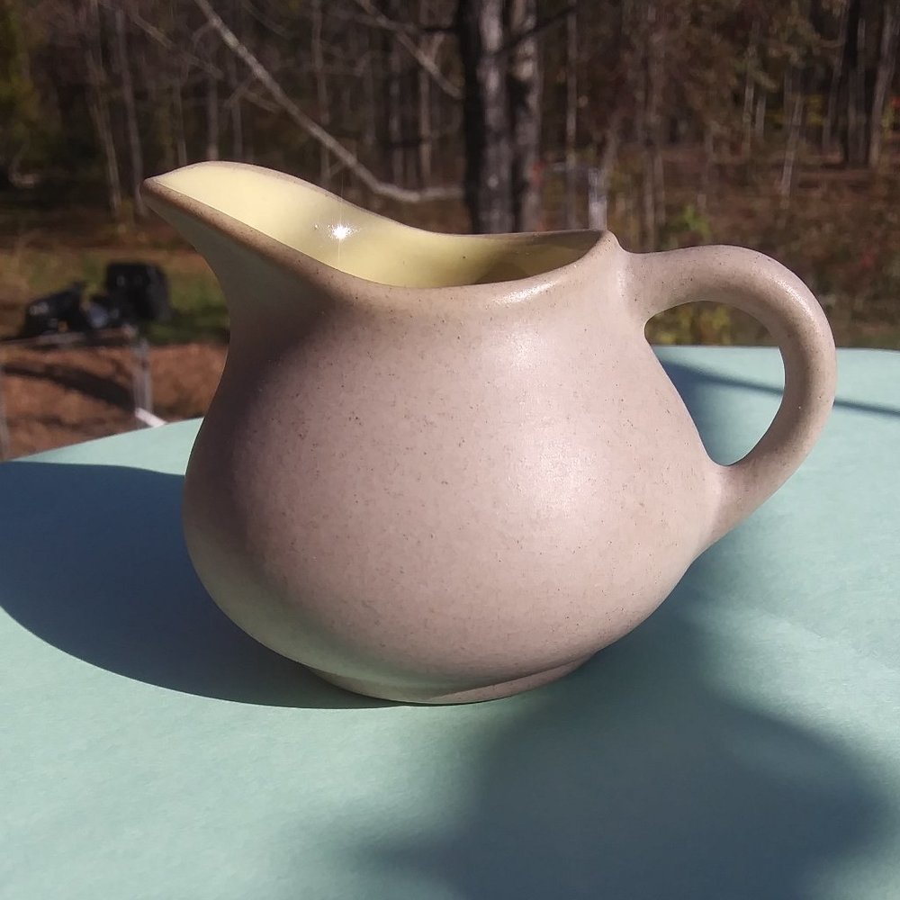 Pigeon Forge Pottery creamer Neutral color with a yellowish glazed inter…